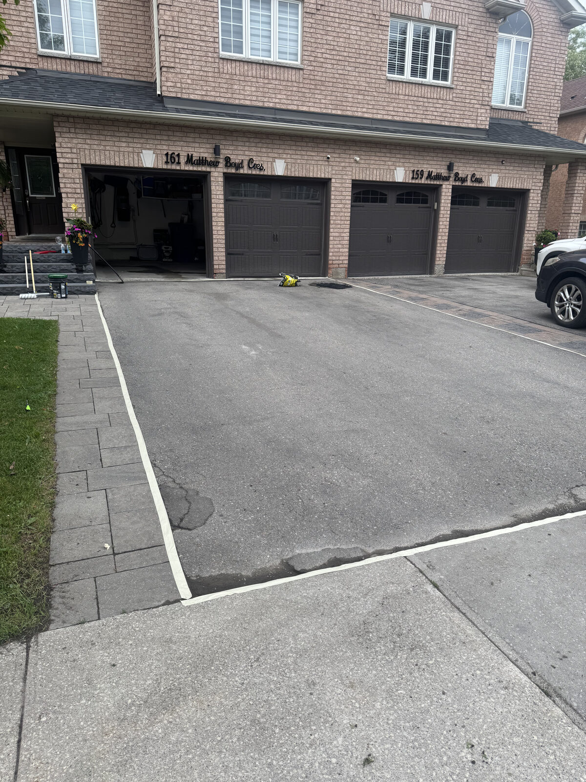 Faded, weather-worn driveway before sealing